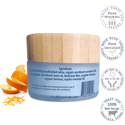 ingredients on a Jar of skincare product with orange slices and labels on a white background